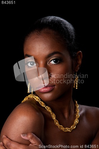 Image of African woman face with gold jewelry