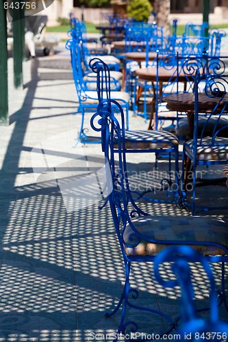 Image of Blue chairs in street cafe