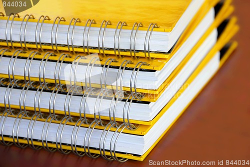 Image of Yellow notebooks stack