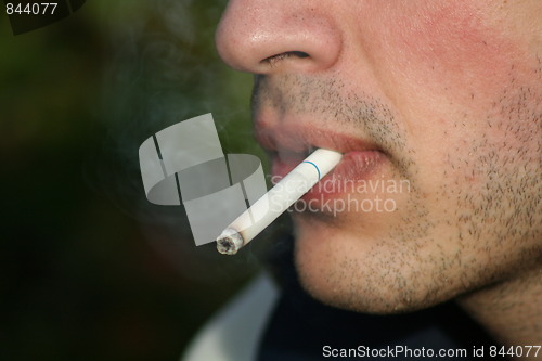 Image of Person Smoking a Cigarette