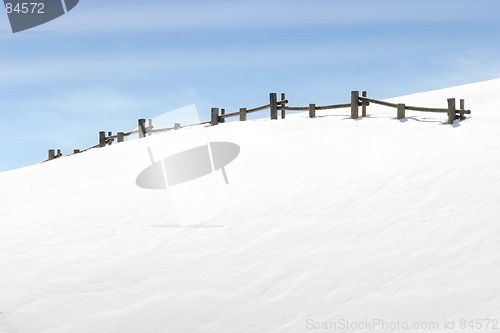 Image of fence on snowy hill