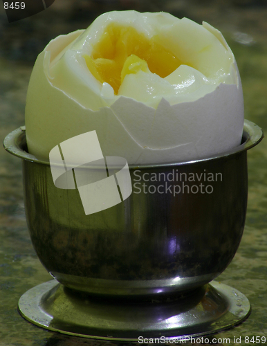 Image of A cracked boiled egg ready to be eaten