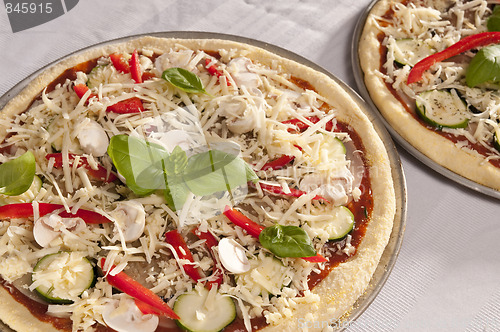 Image of Uncooked pizza.
