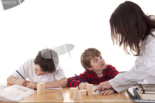 Image of Two students with the teacher