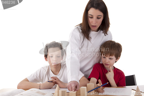 Image of Two students with the teacher