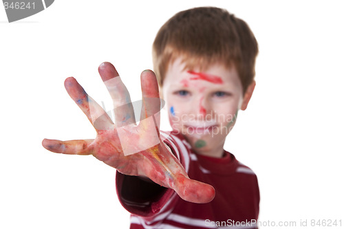 Image of hand hint of red, with the kid blurred