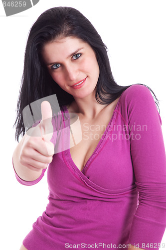 Image of Young pretty women with thumb raised as a sign of success, thumbs up