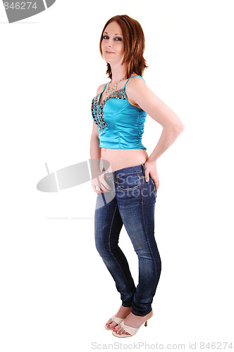 Image of The young girl in jeans and blue top.