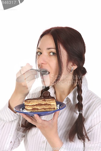 Image of Beautiful woman eating piece of cake