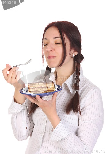 Image of Beautiful woman eating piece of cake