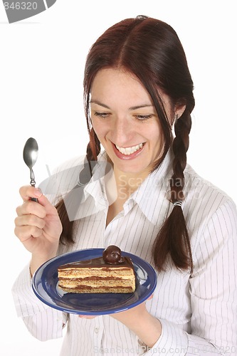 Image of Beautiful woman eating piece of cake