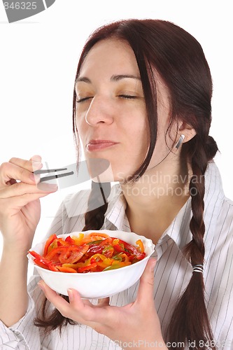 Image of Beautiful woman eating with chopsticks