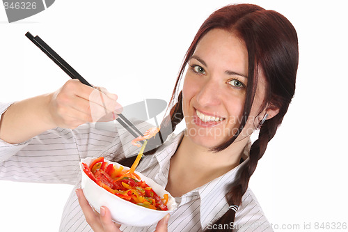 Image of Beautiful woman eating with chopsticks