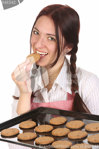 Image of housewife eating a slice of chocolate cake 