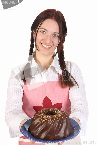 Image of housewife showing off bundt cake