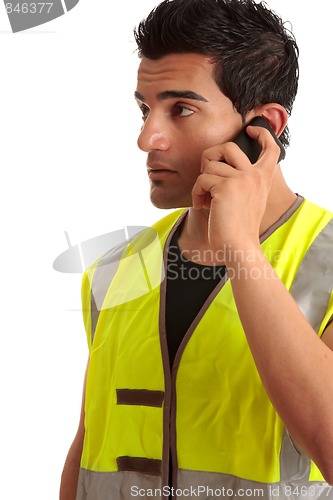 Image of Tradesman handyman on the phone