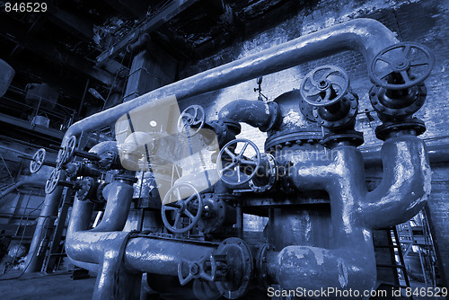 Image of different size and shaped pipes at a power plant