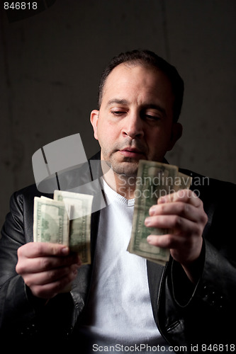 Image of Man Counting His Money