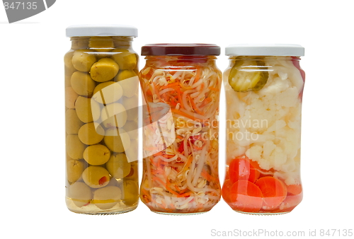 Image of Glass jars with marinated vegetables  isolated on the white back