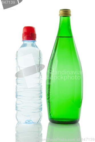 Image of Bottles  of mineral water reflected on white background