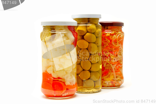 Image of Glass jars with marinated vegetables  isolated on the white back