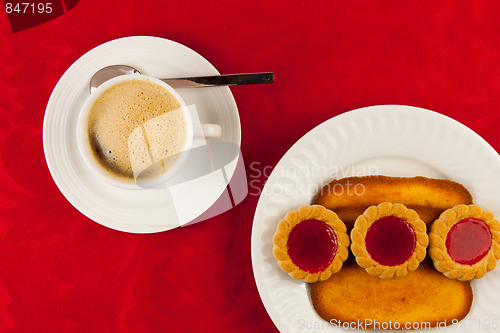 Image of Coffee and cookies on a red background