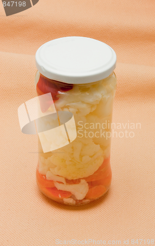 Image of Glas jars with marinated vegetables  isolated on the white backg