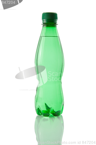Image of A bottle of mineral water reflected on white background