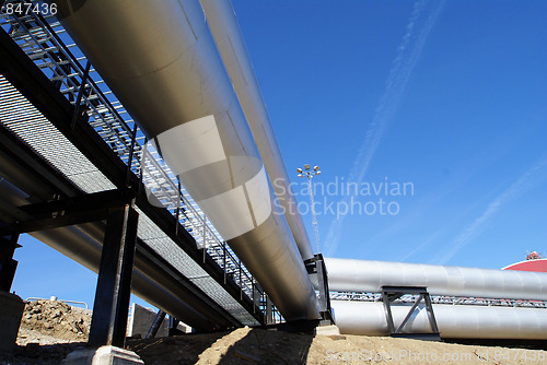 Image of Pipes, tubes, smokestack at a power plant