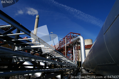 Image of Pipes, tubes, smokestack at a power plant