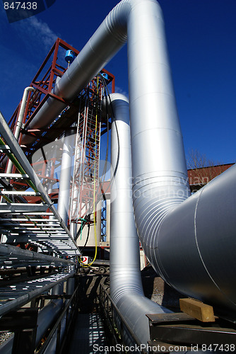 Image of Pipes, tubes, cables and equipment at a power plant