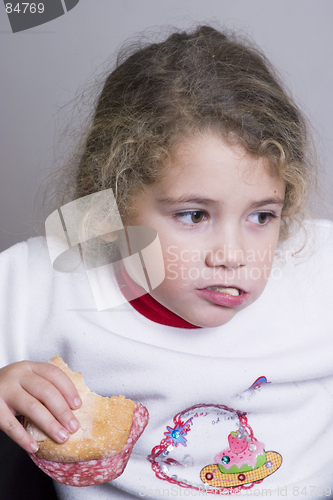 Image of little girl having a sandwich