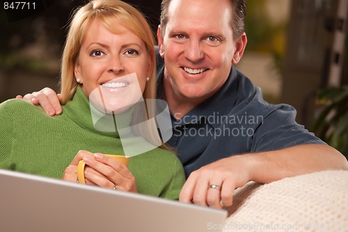 Image of Handsome Couple Using Laptop