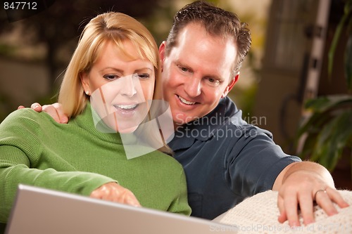 Image of Handsome Couple Using Laptop