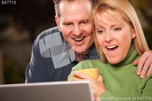 Image of Handsome Couple Using Laptop