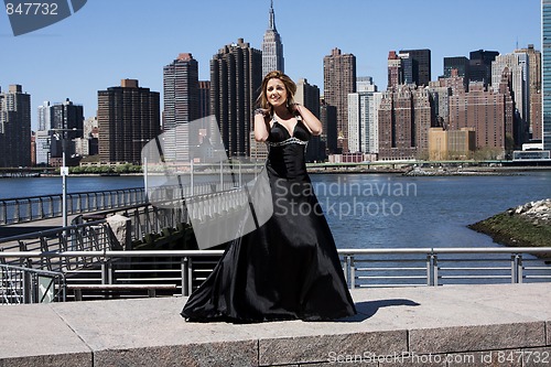 Image of Woman in black cocktail dress