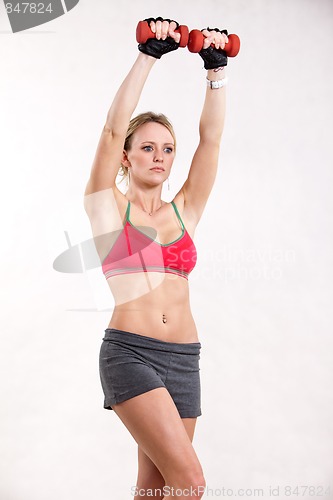 Image of Attractive twenties caucasian blonde woman exercising