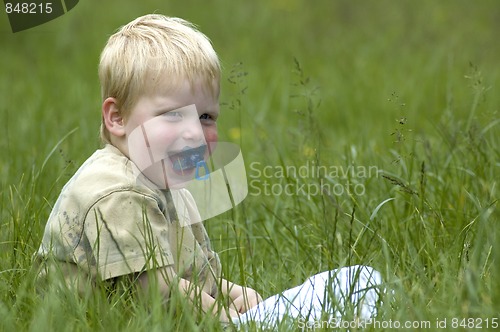 Image of Little boy in the grass