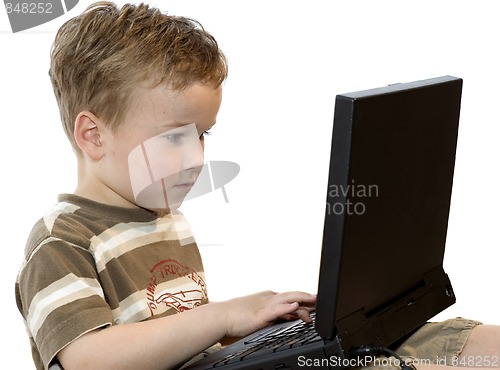 Image of Boy working on a laptop