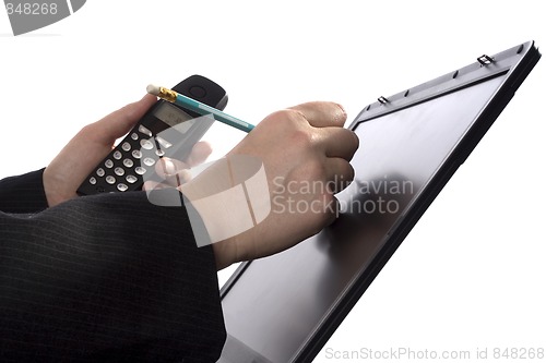 Image of Businessman writing notes on a touchscreen