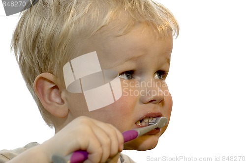 Image of Kid brushing teeth