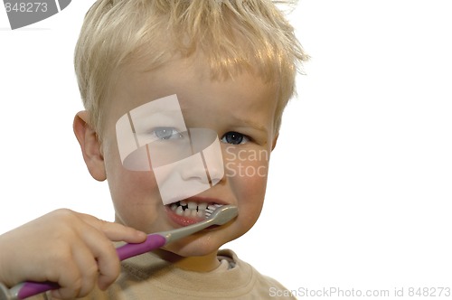 Image of Kid brushing teeth