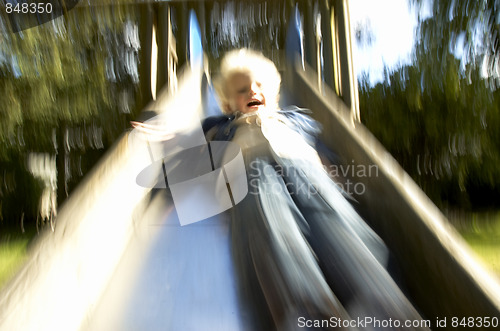 Image of Boy down the slide