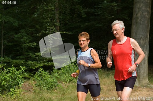 Image of senior couple running