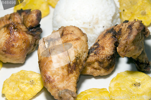 Image of fried chicken tostones and white rice