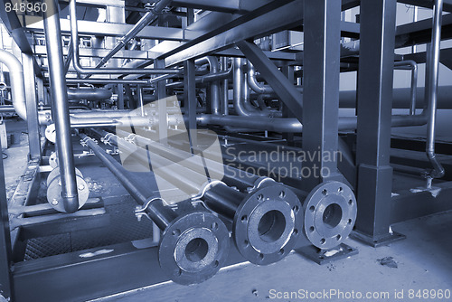 Image of different size and shaped pipes at a power plant