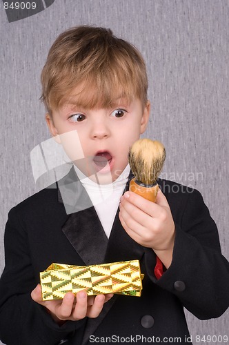 Image of Boy and gift box and shaving brush