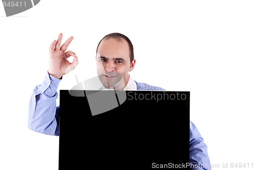 Image of Young businessman holding a blackboard displaying the sign of success