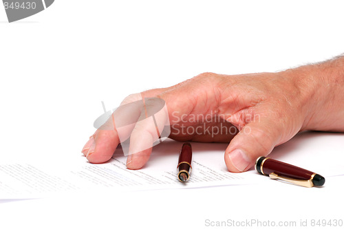 Image of hand on a paper with a fountain pen