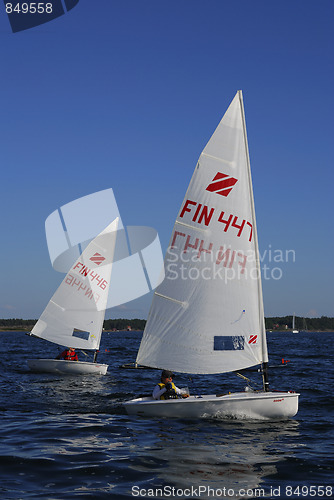 Image of Two small sailboats.